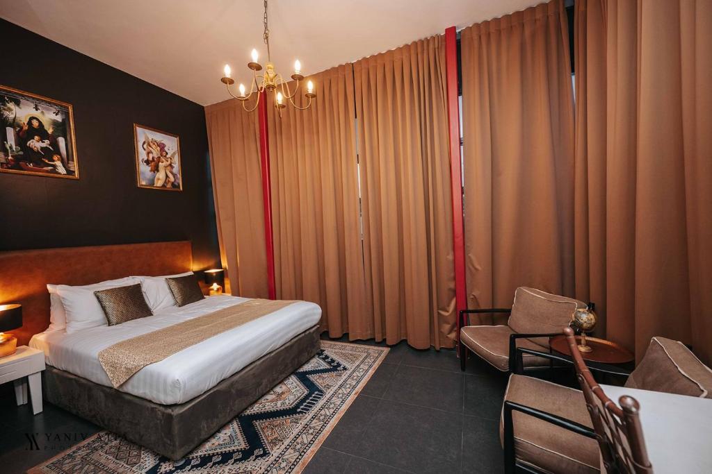 Postel nebo postele na pokoji v ubytování INTA Hotel
