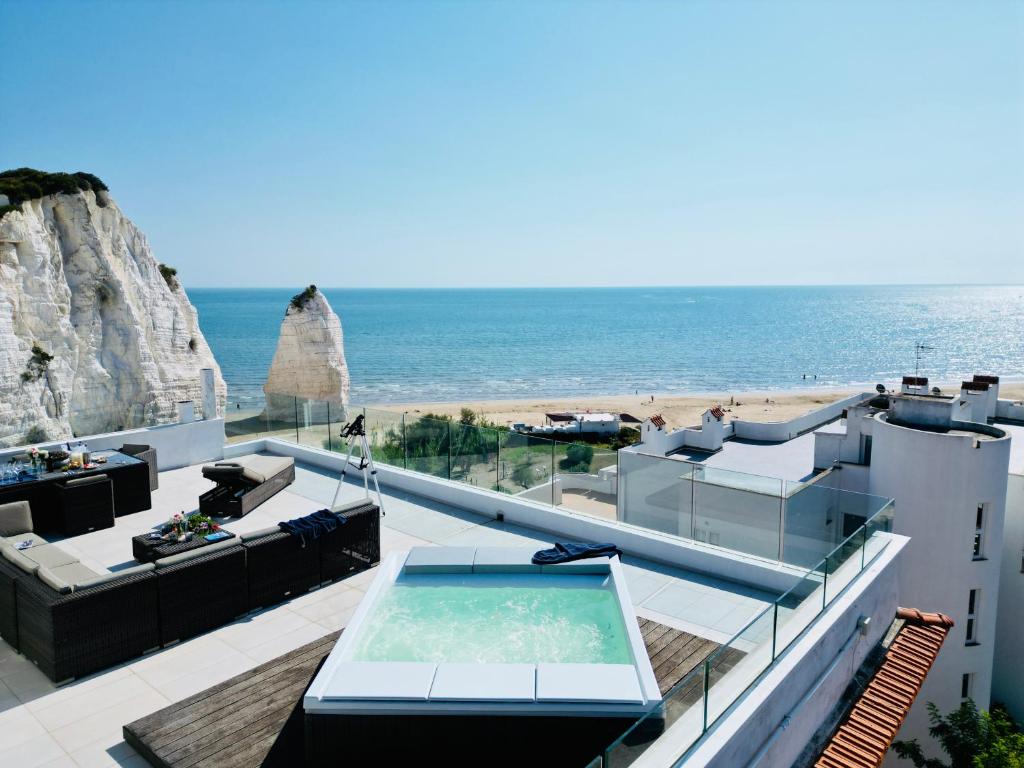 a view of the ocean from a building with a pool at V Penthouse in Vieste