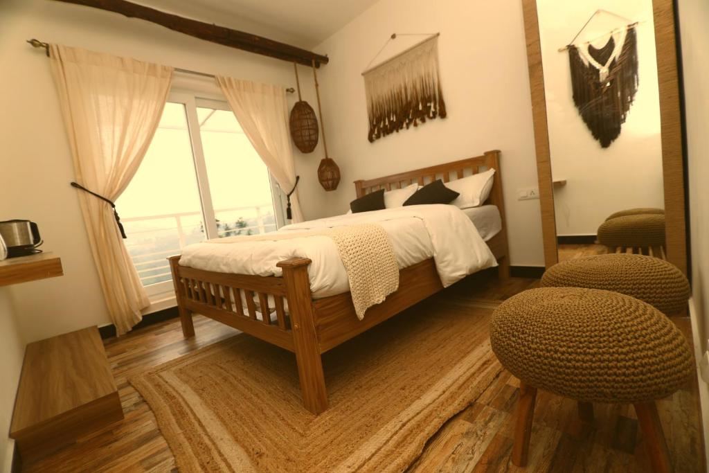 Tempat tidur dalam kamar di KACHINS Homes