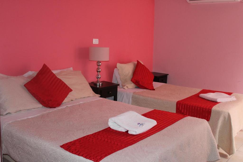 Postel nebo postele na pokoji v ubytování Hotel Boutique La Orquidea
