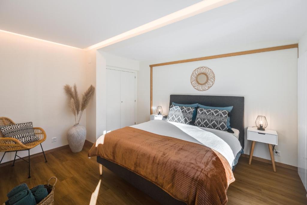 Ένα ή περισσότερα κρεβάτια σε δωμάτιο στο Bijou Lohnerblick - sonnig mit Terrasse&Bergsicht
