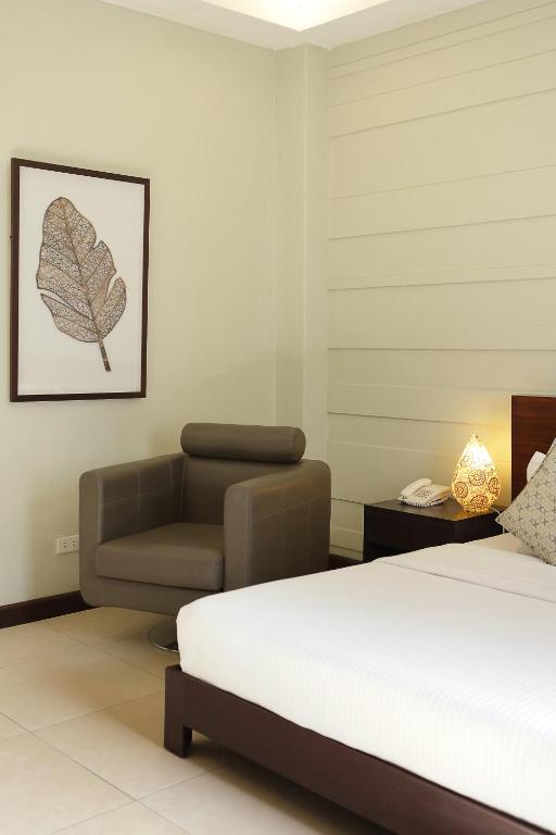 Postel nebo postele na pokoji v ubytování Alba Uno Hotel