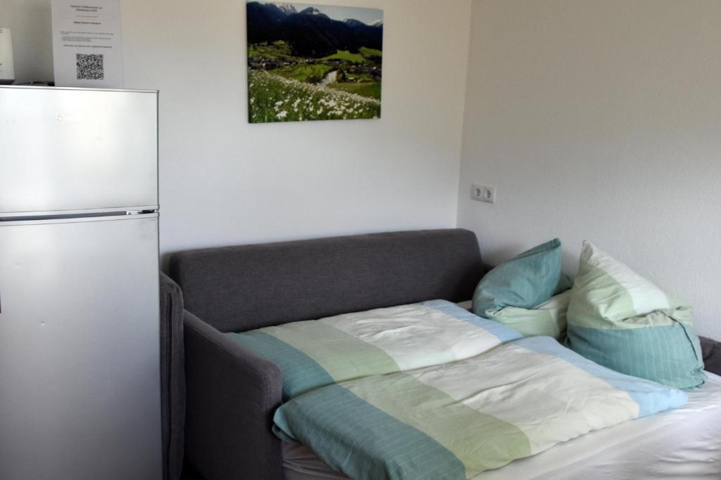 Postel nebo postele na pokoji v ubytování Gästehaus Köll