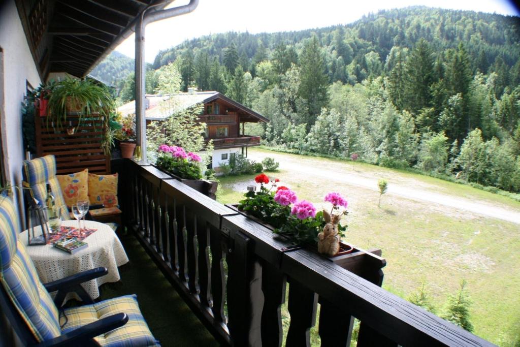 a balcony with a view of a house at Alpenspatzl in Reit im Winkl