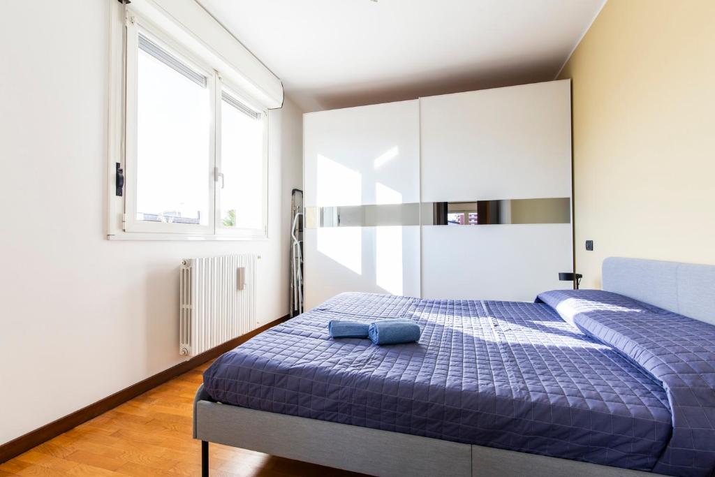 Postel nebo postele na pokoji v ubytování Legnano 20