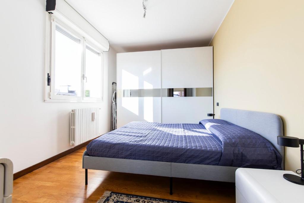 Postel nebo postele na pokoji v ubytování Legnano 20