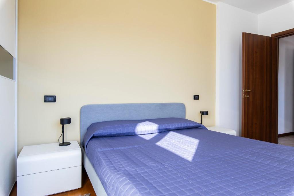 Postel nebo postele na pokoji v ubytování Legnano 20