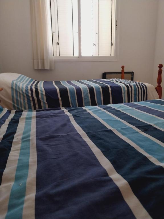 Postel nebo postele na pokoji v ubytování Calafell beach experience- Calafell playa
