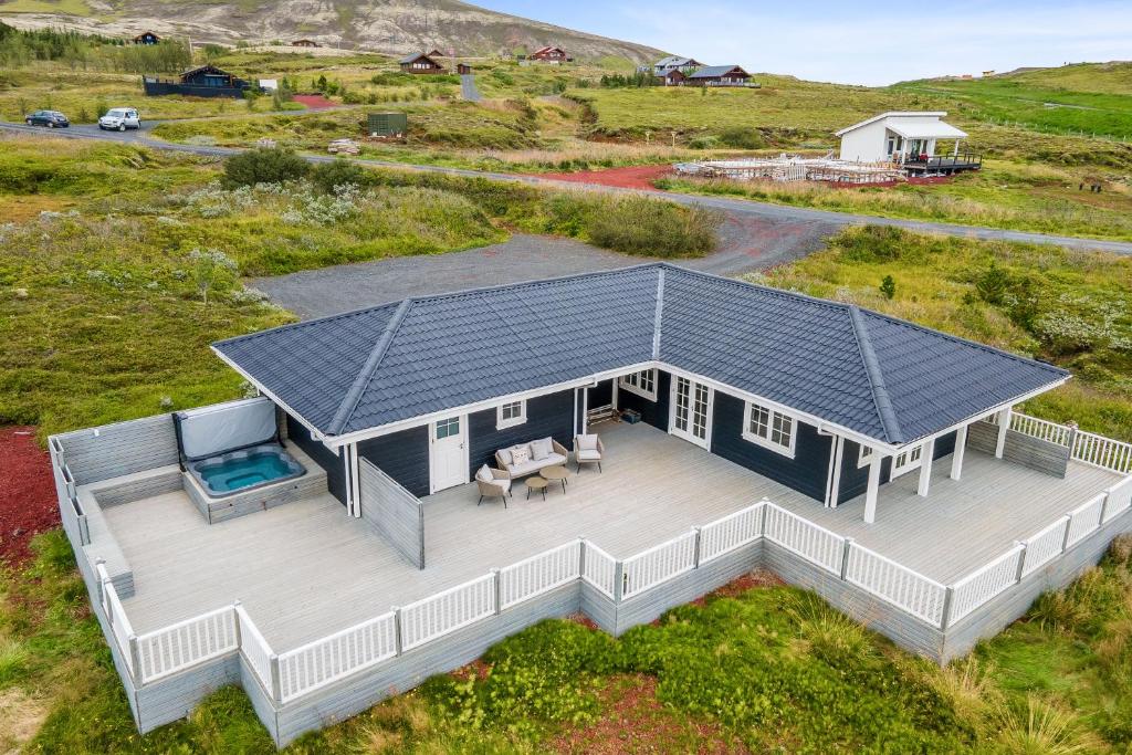 an overhead view of a house with a solar roof at Venture Vacations-Golden Circle Hot Tub Cabin in Selfoss