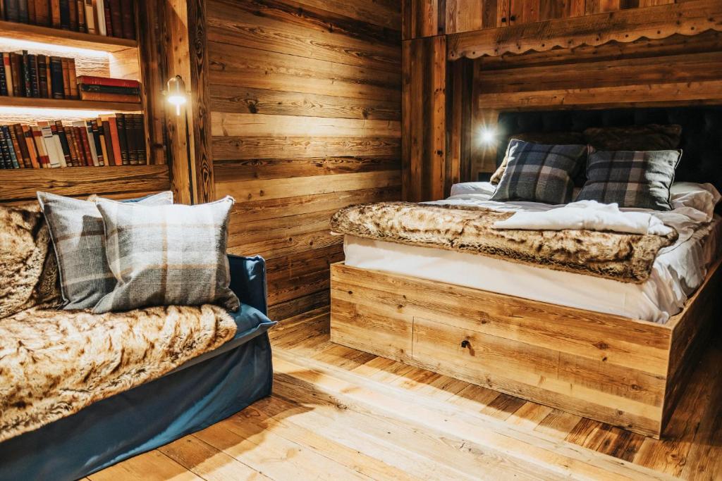Rúm í herbergi á Chalet Cime Bianche