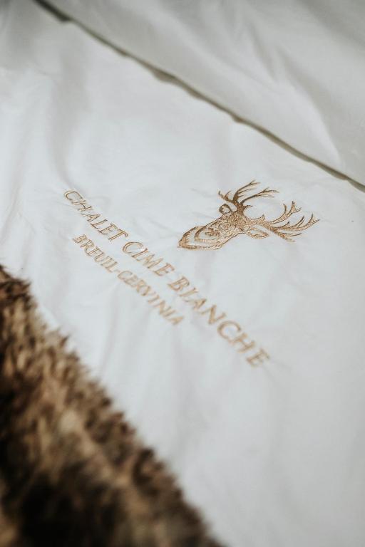 Rúm í herbergi á Chalet Cime Bianche
