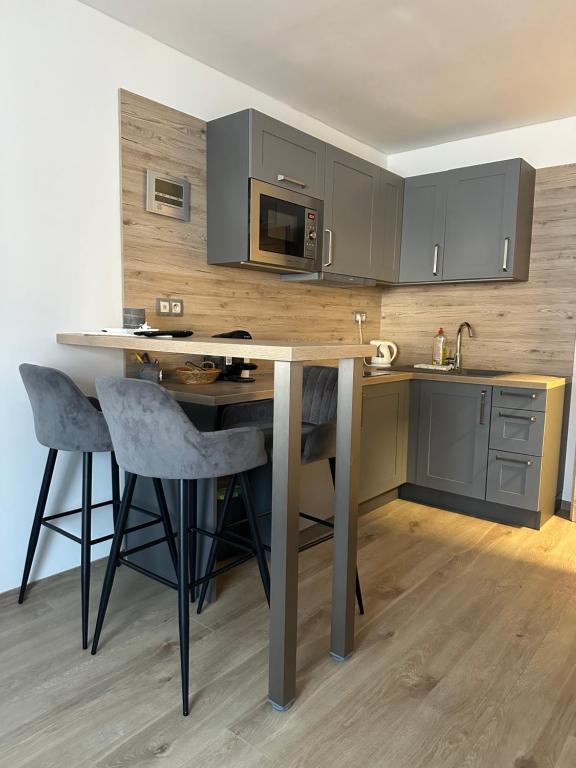 Kuchyň nebo kuchyňský kout v ubytování Apartmány Telgárt