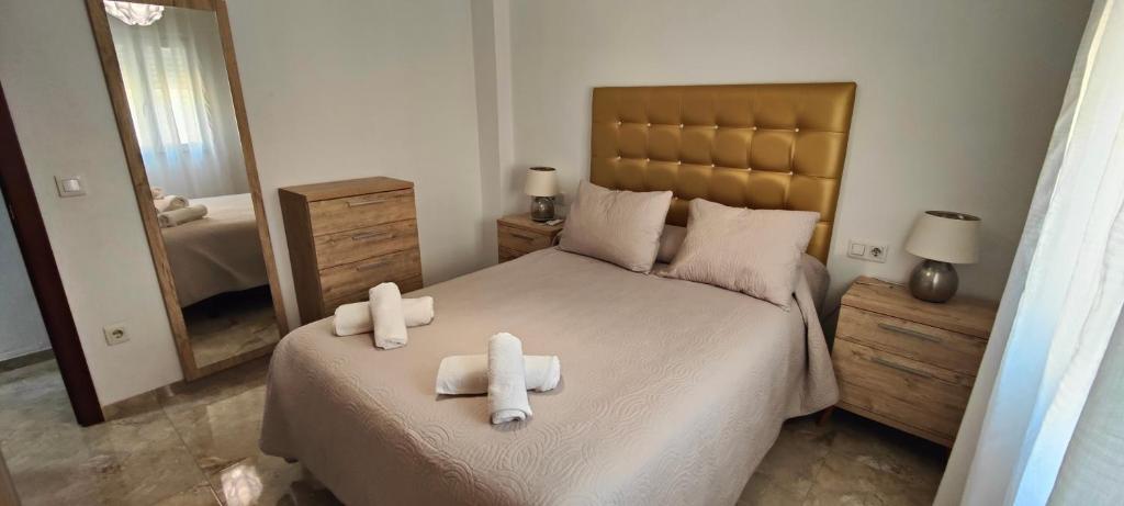 Postel nebo postele na pokoji v ubytování Cuadro de la Virgen - Vivienda Turistica
