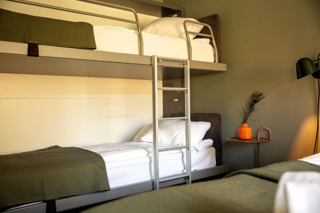 Postel nebo postele na pokoji v ubytování Spar Hotel Gårda