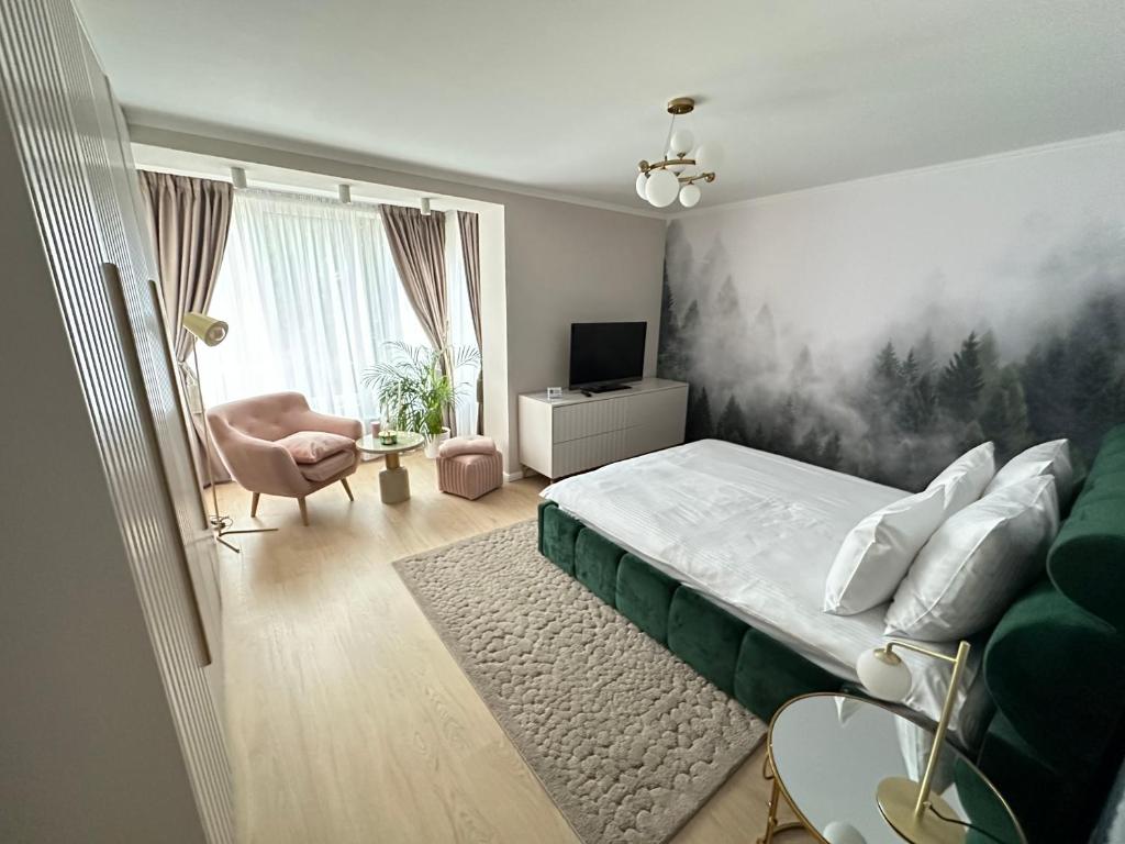 A bed or beds in a room at Sovata Apartment