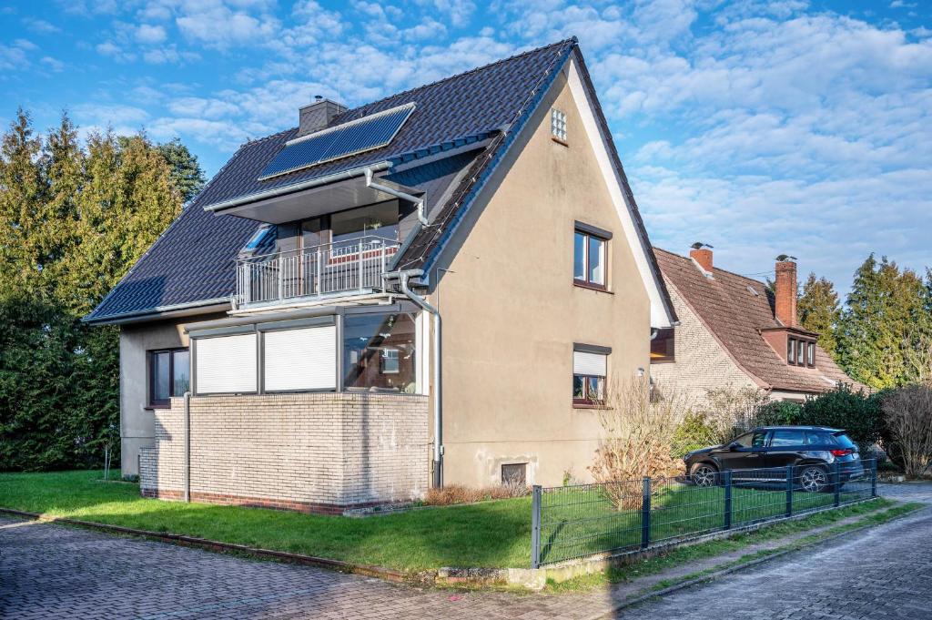 a house with solar panels on the roof at Haus Heidorn in Sittensen