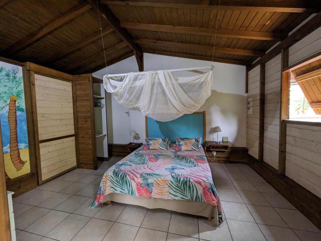Postel nebo postele na pokoji v ubytování Domaine de Léranie