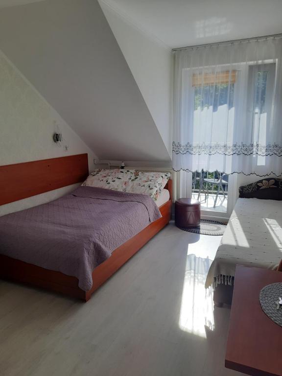 Posteľ alebo postele v izbe v ubytovaní Willa Kamako
