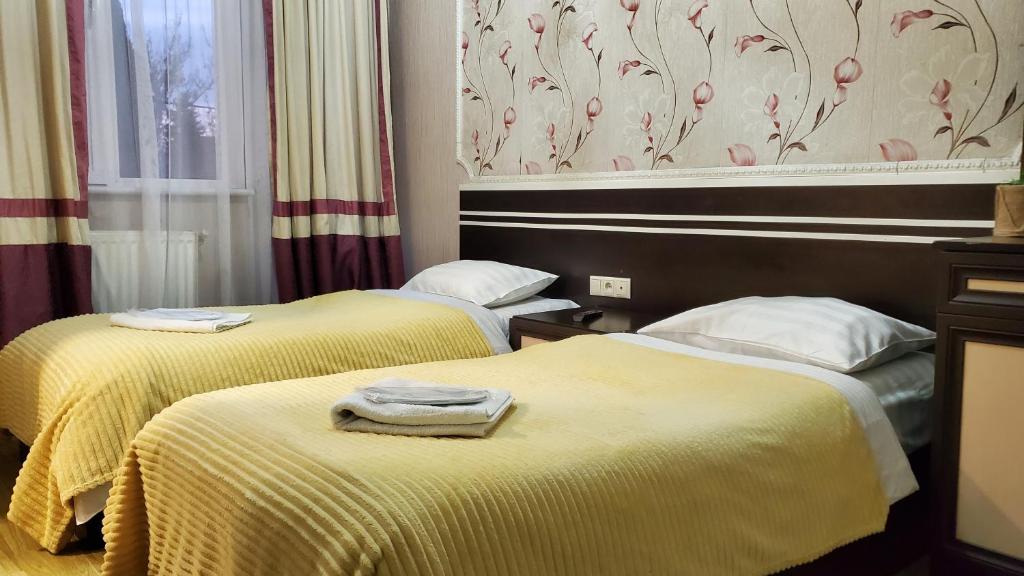 Postel nebo postele na pokoji v ubytování Hotel Antalia