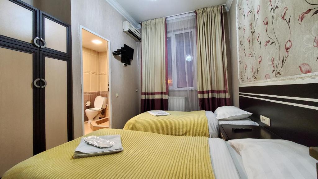 Postel nebo postele na pokoji v ubytování Hotel Antalia