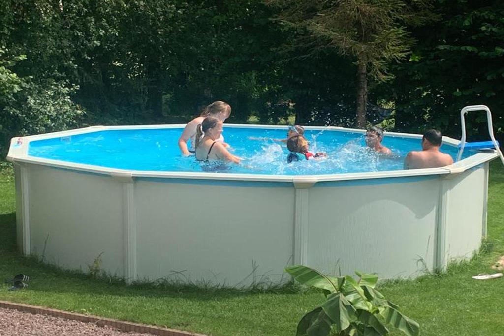 a group of people in a hot tub at Mini Camping Drentse Monden in Nieuw-Weerdinge