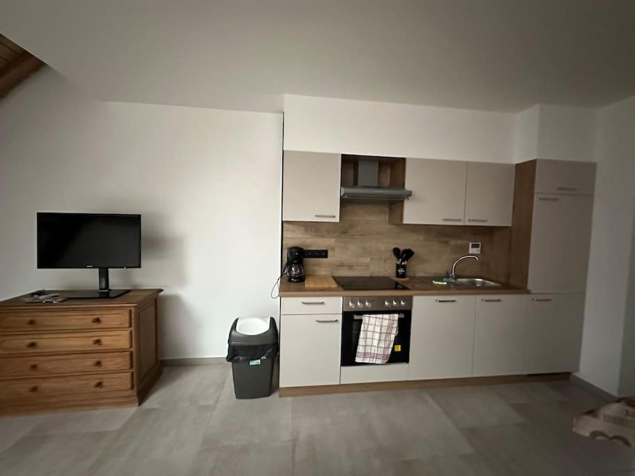 Kuchyň nebo kuchyňský kout v ubytování Gîte de la vieille grange