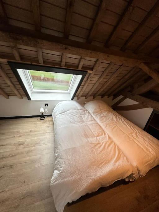 Postel nebo postele na pokoji v ubytování Gîte de la vieille grange