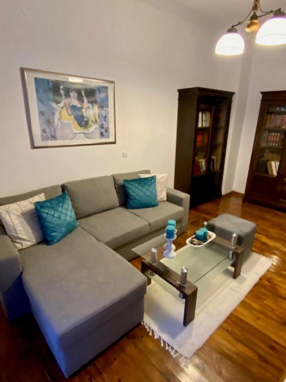 a living room with a couch and a coffee table at Zante Town Apartment in Zakynthos