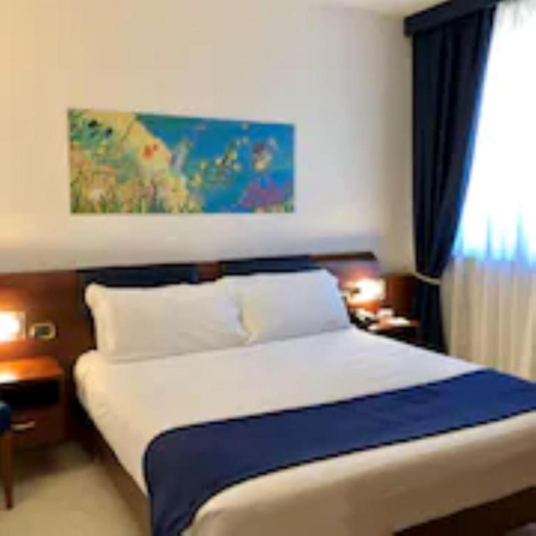 Postel nebo postele na pokoji v ubytování Best Western Hotel Nettuno