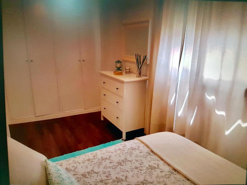 Postel nebo postele na pokoji v ubytování Apartamento cerca de la playa y Ciudad de las Ciencias