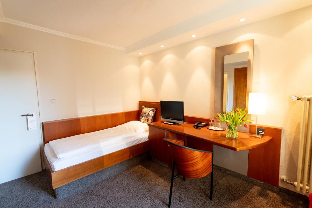 TV a/nebo společenská místnost v ubytování Hotel Carlton Munich