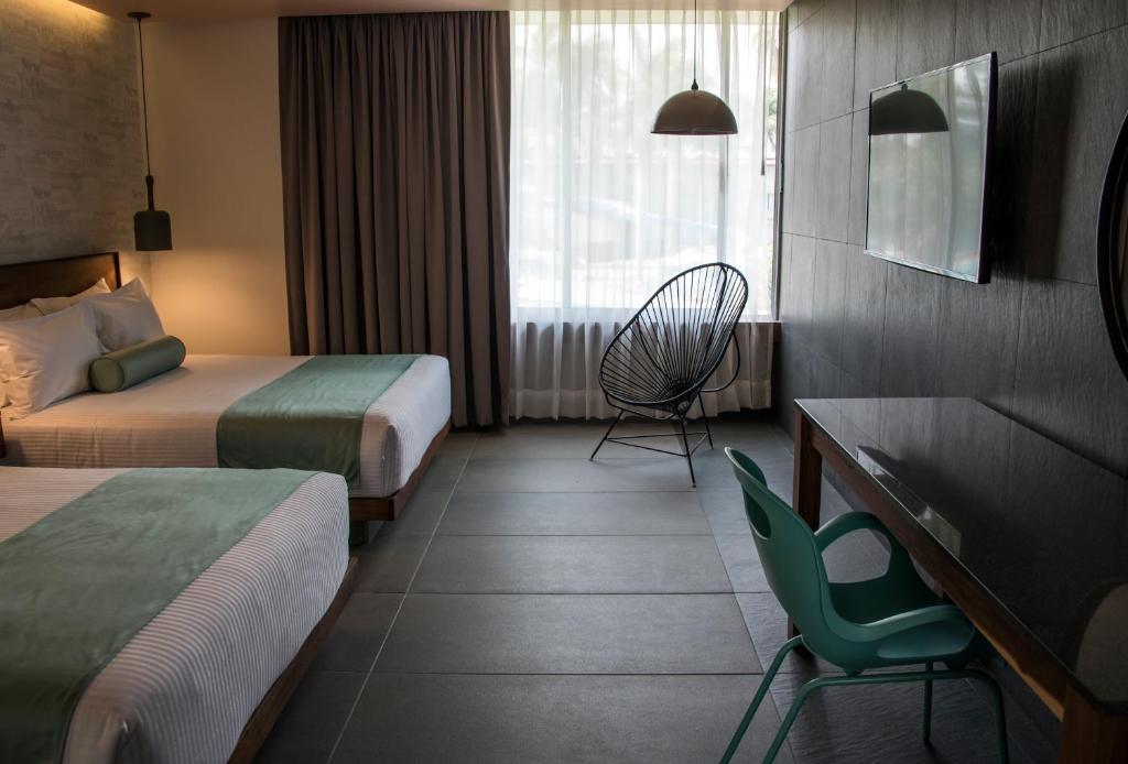 Postel nebo postele na pokoji v ubytování Hotel Y Parque Acuático La Caldera