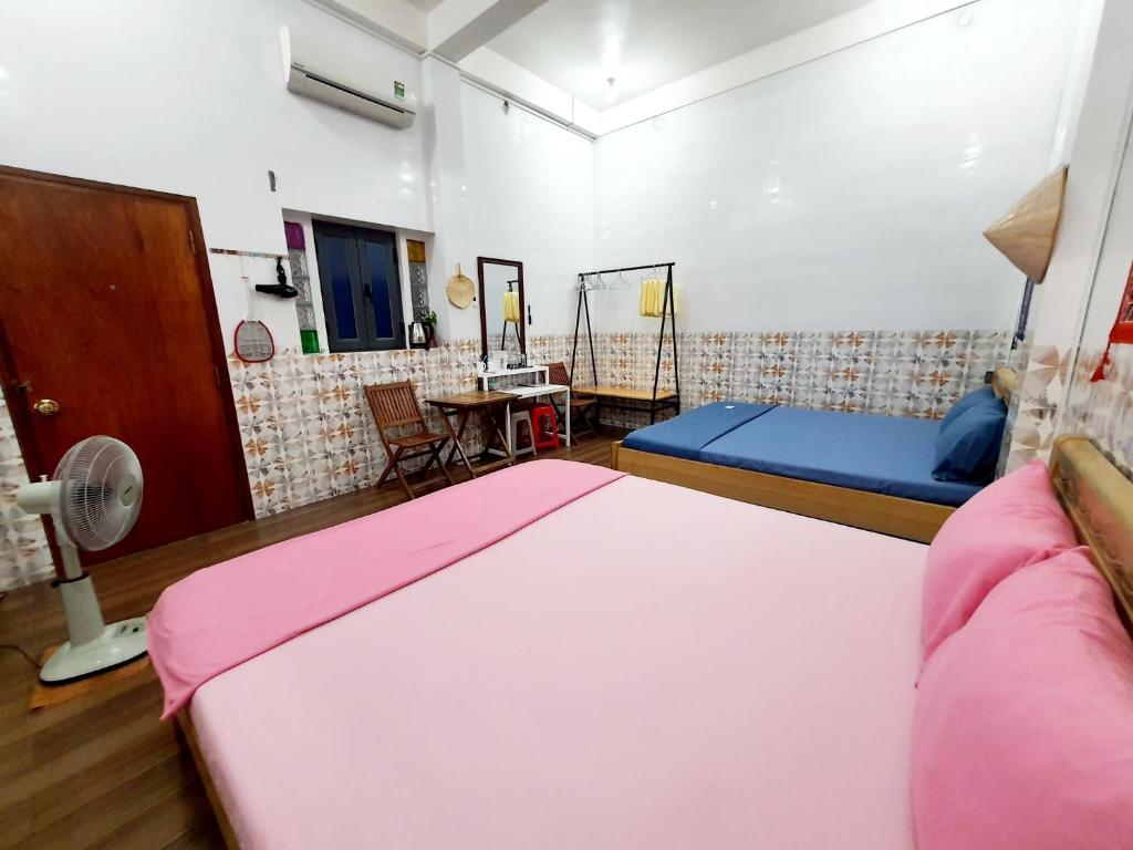 Postel nebo postele na pokoji v ubytování Homestay Khoa Chaudoc
