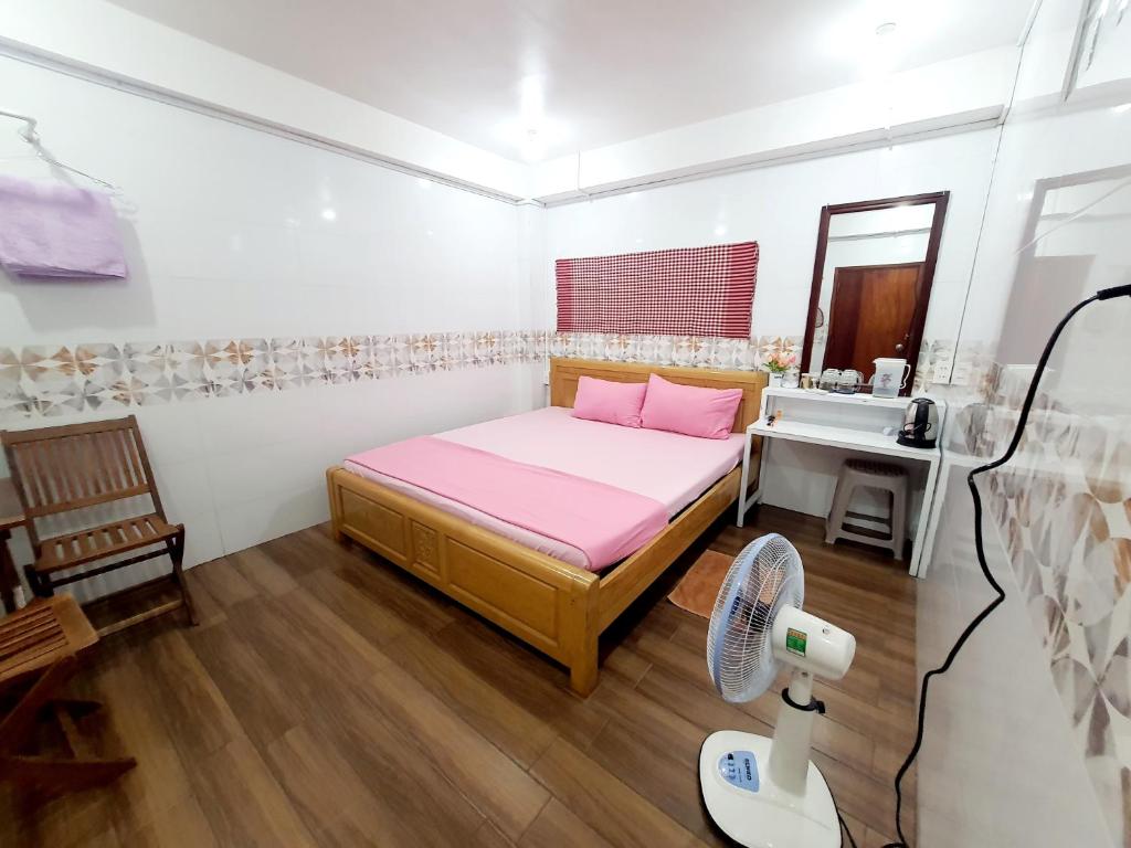 Postel nebo postele na pokoji v ubytování Homestay Khoa Chaudoc