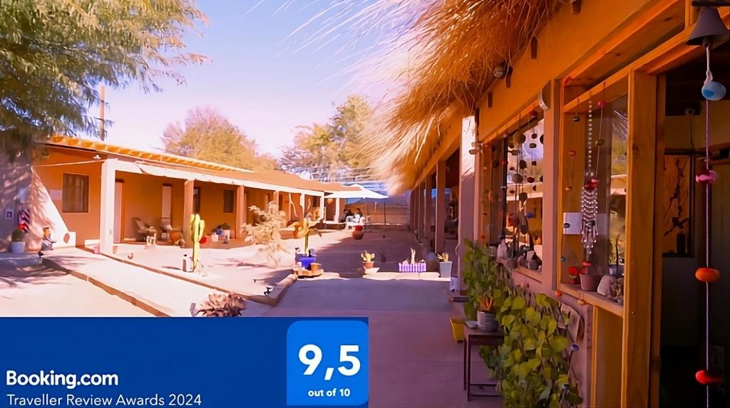 a view of a building with a sign that at Atacama Checar, Hostal in San Pedro de Atacama