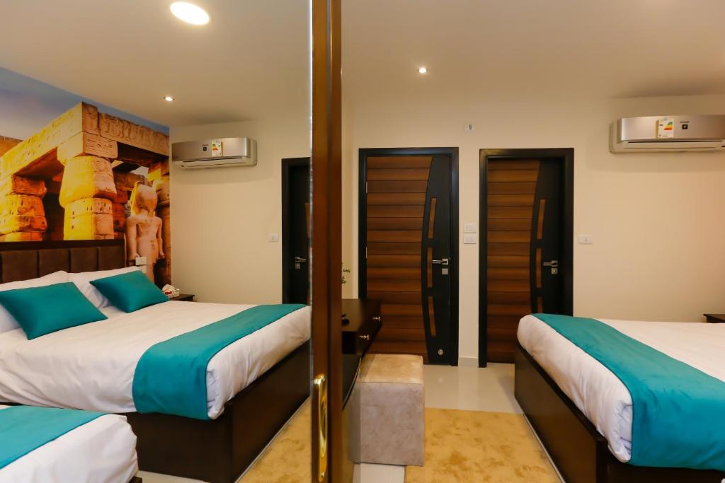 Letto o letti in una camera di Diamond Pyramids View Inn
