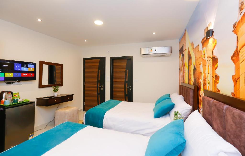Letto o letti in una camera di Diamond Pyramids View Inn