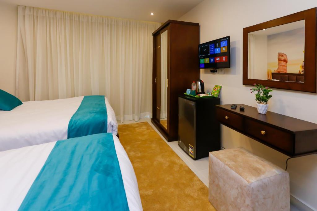 Letto o letti in una camera di Diamond Pyramids View Inn