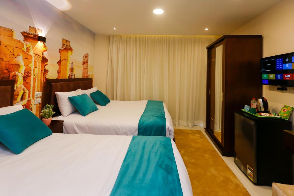 Letto o letti in una camera di Diamond Pyramids View Inn