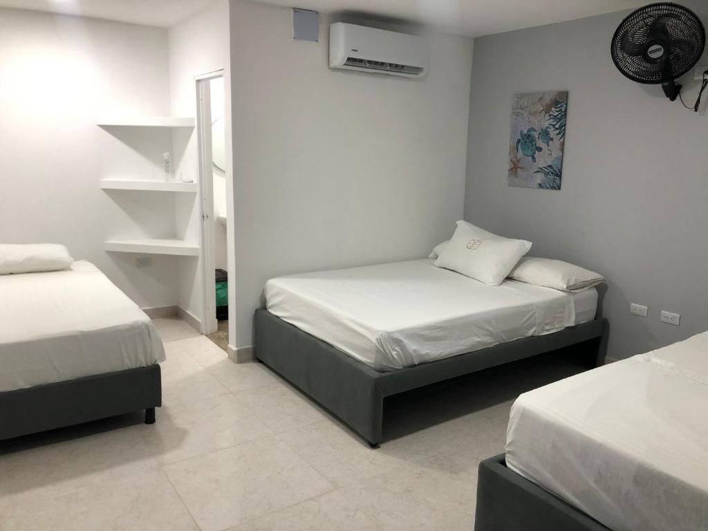 A bed or beds in a room at Manglearena