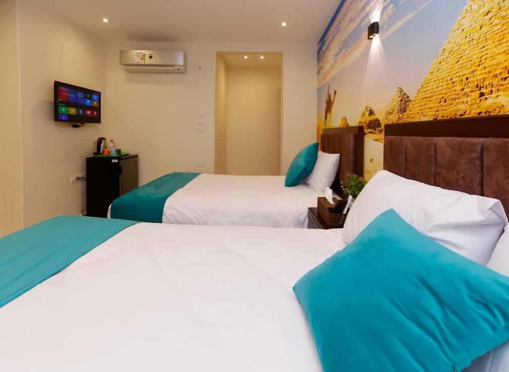 Letto o letti in una camera di Diamond Pyramids View Inn