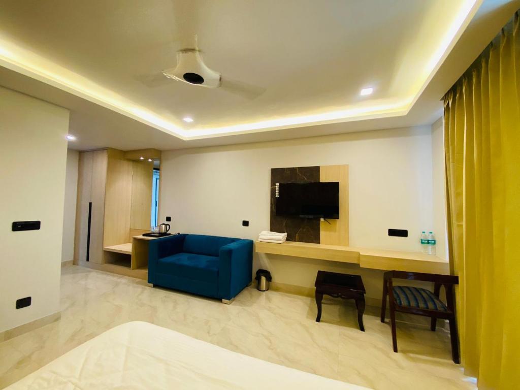TV a/nebo společenská místnost v ubytování Hotel Holiday Grand