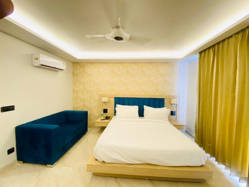 Postel nebo postele na pokoji v ubytování Hotel Holiday Grand