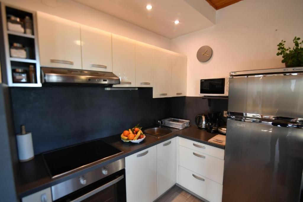 Kuchyň nebo kuchyňský kout v ubytování Apartments for families with children Opatija - Pobri, Opatija - 7890