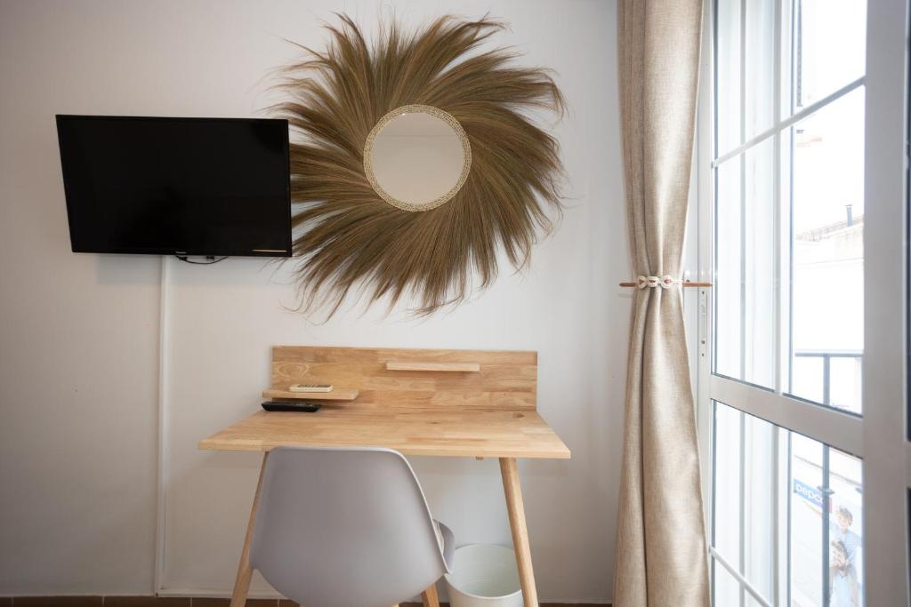 TV a/nebo společenská místnost v ubytování Naim Guest House Nerja