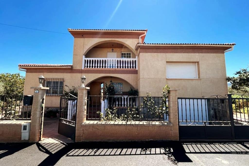 a house with a fence in front of it at Casa Polícar Marta in Polícar