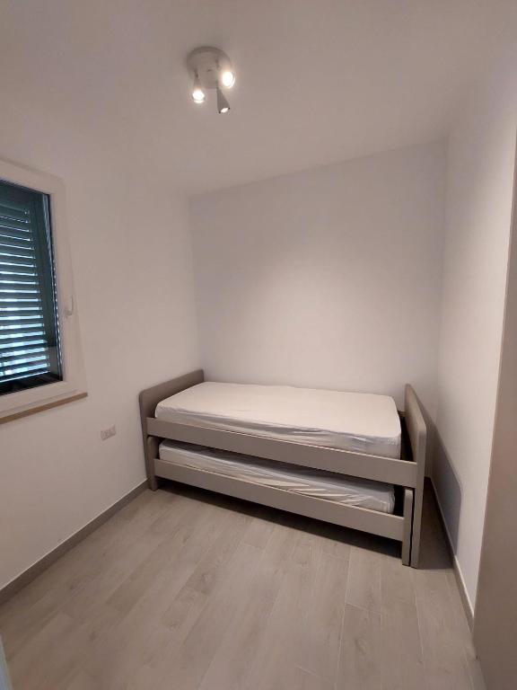Postel nebo postele na pokoji v ubytování Pitagora Residence