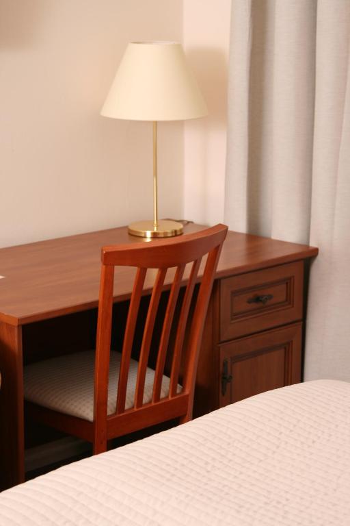 Postel nebo postele na pokoji v ubytování Hotel Klara