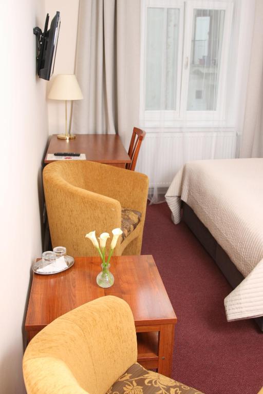 Postel nebo postele na pokoji v ubytování Hotel Klara