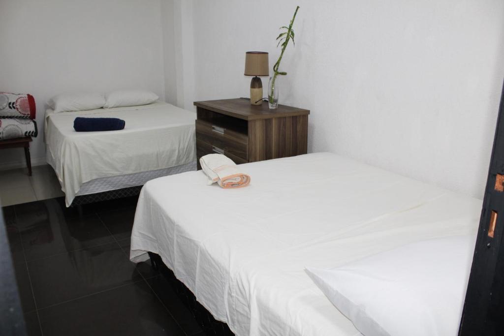 Postel nebo postele na pokoji v ubytování Ap 90 O´ H Apart
